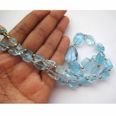 This Listing Is For Blue Topaz Beads, Swiss Blue Topaz Necklace, Faceted Tumbles, 15mm To 8mm Each, 15 Inch Strand, 28 Pieces Approx. Gemstone: Blue Topaz Size(mm): 15-8mm Length(inch): 28 Pieces Weight: 341gms Color: Sky Blue Item Code : GFJP (Measurements, number of pieces and weight are close to approximation.) 100% Genuine Great quality for making Necklace , Earrings, Bracelet or any other jewelry. My mission is to supply authentic and other wide range of high quality gemstones at unmatched Blue Faceted Beads For Jewelry Making, Blue Faceted Gemstones Round Beads, Blue Faceted Round Bead Gemstones, Swiss Blue Topaz Necklace, Blue Topaz Necklace, Topaz Necklace, Raw Diamond, Necklace Blue, Swiss Blue Topaz