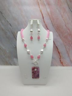 "Handmade and designed by me-one of a kind necklace set-spiral bead crochet necklace with pink seed beads-24\" long-a 2 1/4\"x1 1/4\" rectangle crazy lace agate pendant beads-quartz barrel beads-silver tone metal tear drop beads-metal beads-2 1/2\" long matching dangle earrings with an ear wire-toggle clasp is in the front-silver tone findings. This beautiful summer necklace set would make great addition to your jewelry wardrobe! The necklace is easy on because of the toggle clasp is in the front!" Pink Bohemian Jewelry With Faceted Beads, Bohemian Pink Jewelry With Faceted Beads, Pink Dangle Jewelry With Faceted Beads, Handmade Pink Jewelry With Round Beads, Pink Beaded Pendant Jewelry, Pink Beaded Chain Dangle Jewelry, Handmade Pink Dangle Jewelry, Pink Dangle Jewelry With Beaded Chain, Handmade Pink Beaded Pendant Necklaces