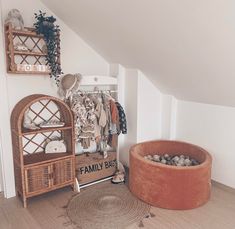 a room that has some items on the floor and in front of an open shelf