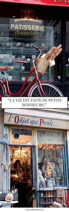 a red bike parked in front of a store