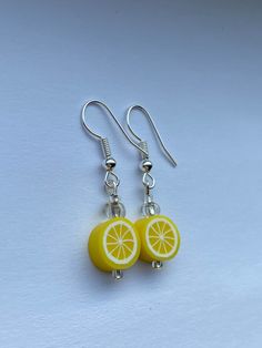 Super cute and fun summer earrings! These include a light weight clay bead and all earrings are made with a stainless steel hypoallergenic wire! Yellow Polymer Clay Earrings With Ear Wire, Hypoallergenic Beaded Earrings With Round Beads For Summer, Cute Adjustable Earrings For Beach, Cute Adjustable Earrings For The Beach, Handmade Novelty Earrings For Everyday, Playful Adjustable Yellow Earrings, Fun Everyday Polymer Clay Jewelry, Fun Hypoallergenic Adjustable Earrings, Summer Fun Nickel-free Earrings