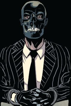 a man in a suit and tie with his arms crossed, wearing a skeleton mask