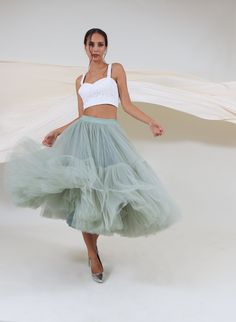 FREE FEDEX DELIVERY INCLUDED! PHONE NUMBER REQUIRED!! Very fluffy tiered skirt is made of soft tulle. This skirt does not add volume to the waist and hips. The entire volume is gathered towards the lower edge: the bottom row layers (together) measure 63m (207ft) of tulle fabric. Pictured skirt is 79cm (31 inches) long, color number 97; it features all-round stretching waistband which stretches very well covering wide variety of waist sizes. All the skirt's features can be varied on demand - do w Tops For Tulle Skirt, Tulle Net Skirt, Tool Skirt Outfit, Personal Manifesto, Missionary Outfits, Tulle Circle Skirt, Tool Skirt, Bridesmaid Tulle, Tulle Skirts Outfit