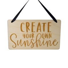 a wooden sign that says create your own sunshine