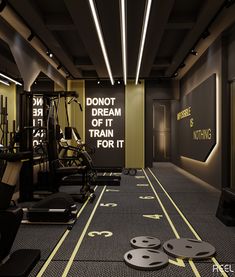 an empty gym with treadmills and exercise equipment on the floor in front of a sign that says don't dream of it train for it