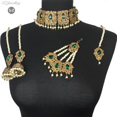 Asian jewellery set. Set includes- Earrings  Tikka Choker Jhumka Wedding Jewelry For Eid With Tilla Detail, Kundan Choker With Latkans For Wedding, Wedding Kundan Choker With Latkans, Traditional Jeweled Wedding Choker, Heavy Green Jewelry For Eid, Green Kundan Necklace For Eid Wedding, Green Latkans Necklace For Wedding, Traditional Jeweled Choker, Wedding Choker Jewelry With Stone Work