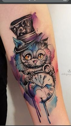 a cat with a clock tattoo on its arm