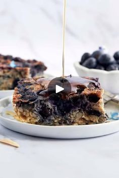 blueberry baked oatmeal bars with honey drizzled on top