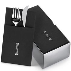 a fork and knife in a black box