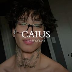 a man with glasses and tattoos on his chest