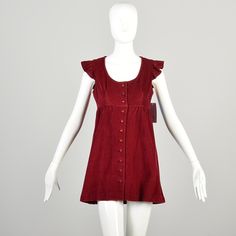 Description: Super cute burgundy velour micro mini dress, could be worn as a tunic top as well. Empire waist accentuates the bust. Buttons up the front with red plastic buttons. Small Ruffles at shoulders.  Condition: Excellent Condition Details: No Notable Flaws Size Marked: Unmarked Approximate Size: Small **Please Check Measurements to be Sure! Textile: Velour Lining Type: Unlined Closure: Button Label: No Label  Era: 1960s Measurements- Shoulder to Shoulder:  16.5" Chest/Bust:  34" Waist:  3 1960s Mini Dress, Empire Waist, Tunic Dress, Ruffles, Dress Clothes For Women, 1960s, Tunic Tops, Dress Outfits, Textiles