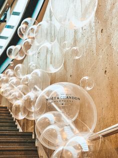 many bubbles are floating in the air near some stairs