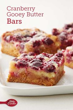 cranberry gooey butter bars on a white plate with the title above it