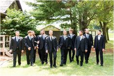 a group of men in suits standing next to each other