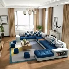 a living room with blue and white furniture in it's centerpiece, including a large sectional couch