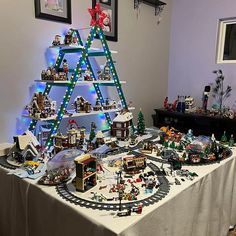 a christmas tree made out of legos on a table