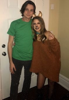 two people dressed up in costumes standing next to each other