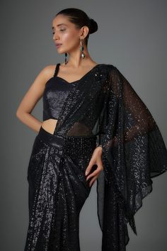 Black pre-stitched saree with sequin embellishments. Comes with padded embellished blouse. - Aza Fashions Fitted Georgette Pre-draped Saree For Party, Fitted Saree For Party, Evening Fitted Pre-draped Saree With Sequins, Glamorous Fitted Pre-draped Saree With Dupatta, Party Wear Fitted Pre-draped Saree In Georgette, Party Wear Fitted Pre-draped Georgette Saree, Semi-stitched Pre-draped Saree For Parties, Sleeveless Georgette Pre-draped Saree For Party, Party Pre-draped Fitted Georgette Saree