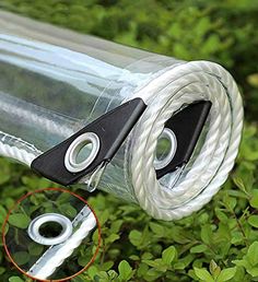 a close up of a plastic bottle with two handles and a rope attached to it