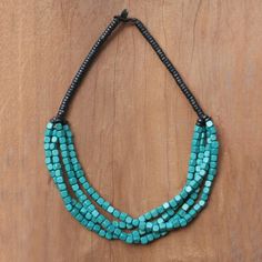 Four lines of teal cubes wrap around each other in this chic beaded torsade necklace, designed and hand-strung by Thai artisan Sumalee Nawakul. The strands are joined by another length of black beads which closes with a button clasp. Made from littleleaf boxwood, the beads are simple wooden shapes on their own, but when combined they create an elegant, eye-catching necklace. Handcrafted Beaded Jewelry, Thread Necklace, Wood Bead Necklace, Wooden Shapes, Buy Wood, Cool Jewelry, Women Artisans, Jewelry Packaging, Necklace Sizes