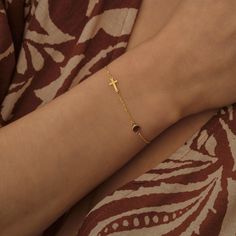 This delicate 14k gold bracelet features a mini cross charm paired with a personalized birthstone, making it a meaningful and elegant piece. Perfect as a thoughtful gift for birthdays, Christmas, or any special occasion, this bracelet combines faith and personal touch in a timeless design. Ideal for women seeking a unique keepsake. ♡ CROSS ∙ BIRTHSTONE ∙ BRACELET ◇  ◇ Made to Order ◇ Pendant Height: 6 mm (0.24'')  ◇ Birthstone diameter: 3mm ◇ Material Options: High Quality 925k Silver and 14k Solid Gold ◇ Color Options: Yellow Gold ∙ Rose Gold ∙ White Gold ◇ All our jewelry is made with passion and care ◇ Package: Ready to Gift - Jewelry Box ♡ HOW ∙ TO ∙ ORDER → → STEP 1: Choose your Chain Length.  → STEP 2: Please select your preferred material and color. → STEP 3: Please use the 'PERSONA Yellow Gold Cross Bracelet As Gift, Yellow Gold Cross Bracelet Gift, 14k Gold-filled Birthstone Bracelets, Gold Cross-shaped Beaded Bracelets For Gifts, Gold Cross Bracelet, Gold Cross-shaped Spiritual Beaded Bracelets, Mini Cross, Birthstone Bracelet, Gold Armband