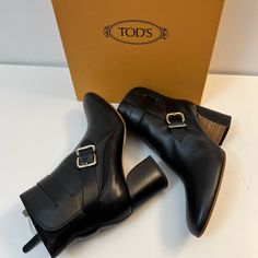 New With Box And Dust Bag ( Never Worn Outside) Made In Italy Soft Leather Buckle, Brand Logo, Black Solid Color, Leather Lining, Zipper Closure, Round Toeline, Square Heel, Covered Heel, Leather Sole, (Top To Heel ): 7.5 Inches, Heels: 2.75 Inches Designer Formal Heeled Boots With Buckle Closure, Designer Heeled Boots With Stacked Heel, Designer Tan Round Toe Heels, Designer Tan Heels With Round Toe, Luxury Tan Round Toe Heels, Luxury Tan Heels With Round Toe, Tan Leather Evening Heels, Tan Round Toe Heels For Evening, Tan Leather Heels For Evening