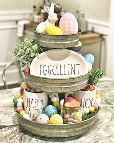 three tiered trays with eggs and easter decorations on top of each other, labeled eggcellint happy easter hop