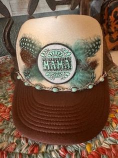 Loving this new Mama hat with beautiful feathers and handmade turquoise hat chain.  One size fits most.  If interested in different color hat I have varitey to much to list. Message me for a different color I'll let you know if I have in stock.  Fast delivery  Have a blessed day! Bohemian Trucker Hat With Flat Brim And Adjustable Fit, Bohemian Adjustable Trucker Hat With Flat Brim, Bohemian Adjustable Trucker Hat For Beach, Bohemian Adjustable Trucker Hat For The Beach, Adjustable Bohemian Trucker Hat For Beach, Bohemian Adjustable Trucker Hat, Adjustable Bohemian Trucker Hat, Bohemian Mini Hat With Feathers, Bohemian Trucker Hat