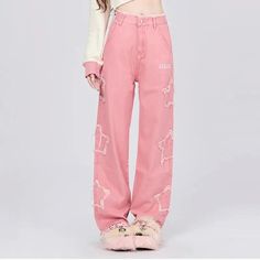 Step out in style with our Women's Pink Vintage High-Waisted Wide Leg Jeans, a perfect blend of classic charm and modern streetwear vibes. Designed for fashion-forward individuals, these jeans feature a vibrant pink hue that makes a bold statement on any occasion. Crafted with high-quality cotton and polyester, these jeans ensure comfort without compromising on style. Ideal for spring and summer, they bring a fresh, funky edge to your wardrobe. Features Material blend of cotton and polyester for durability and comfort. Non-stretch cotton denim ensures a flattering fit that holds its shape. High-waisted design accentuates your silhouette. Functional pockets and decorative elements such as fake zippers and vintage buttons enhance style and practicality. Light wash finish for a relaxed, worn- Funky Jeans, High Waisted Wide Leg Jeans, Modern Streetwear, Jean Large, High Street Fashion, Rose Vintage, Stylish Blouse, Decorative Elements, Pink Vintage