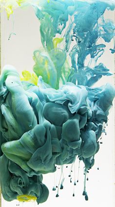 an abstract painting with blue and green ink in it's water, against a white background