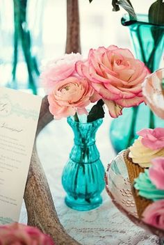 a collage of photos with pink and blue flowers in vases, plates, napkins