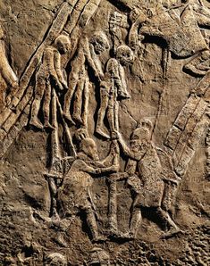 an image of some kind of artwork on the side of a rock wall with people and animals in it