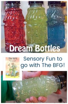 three bottles filled with different colored liquid and the words dream bottles are in front of them