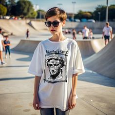 Discover a unique blend of classical art and modern street style with our 'Vandalism Art Style T-Shirt.' This eye-catching design features the iconic David statue adorned with graffiti, giving it a bold, rebellious edge. Perfect for art enthusiasts and fashion-forward individuals alike, this t-shirt makes a statement with its intricate details and high-quality print. Crafted from soft, breathable fabric, this t-shirt ensures maximum comfort and durability. Whether you're heading out for a casual day or looking to stand out at an event, this t-shirt is your go-to choice. Embrace the fusion of art and fashion with our 'Vandalism Art Style T-Shirt' and express your unique style effortlessly. Soft, comfortable fabric High-quality print Unique David statue graffiti design Perfect for casual wea Artistic Oversized T-shirt For Streetwear, Artistic Streetwear Summer Tops, Artistic Summer Streetwear Tops, Artistic White Tops For Streetwear, Artistic Summer Tops For Streetwear, Artistic Summer Streetwear T-shirt, Artistic Summer T-shirt For Streetwear, Artistic Graphic T-shirt For Streetwear, Artistic Graphic Print T-shirt For Streetwear