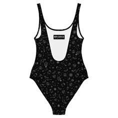 Dive into dark style this summer with Goth Cloth Co.'s Gothic Halloween One-Piece Swimsuit. Featuring a haunting pattern of ghosts, pumpkins, black cats, and spider webs in black and white, this swimsuit offers gothic elegance for all figures. Perfect for lounging by the beach or poolside, this swimsuit brings out your best features with its smooth fabric and flattering design. Key Features: Chlorine-resistant fabric: Made from 82% polyester and 18% spandex for durability. Cheeky fit: With a sco Black Halloween Party Swimwear, Black Swimwear For Halloween Costume Party, Black Stretch Rave Swimwear, Black Swimwear For Summer Costume Party, Fitted Halloween Swimwear For Pool, Rave Swimwear For Summer Costume Party, Black Rave Swimwear, Gothic Elegance, Dark Style