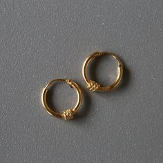 Delicate minimal gold plated sterling silver jewelry. Our products are made with 925 sterling silver and are hypoallergenic and nickel free! This listing is for a PAIR of hoops.  ✨ Hoop dimensions 10mm outer diameter, 8mm inner diameter  1.2mm thickness ✨ Material 925 sterling silver  18k gold plating Your earrings will come in a cute gift box! We will ship them out asap, shipping is fixed price for as many items as you want. 🎉 Our new silver supply shop: https://www.etsy.com/shop/InspireSilver Minimalist Everyday Earrings, Minimalist Everyday Hallmarked Earrings, Minimalist Hypoallergenic Jewelry For Everyday Use, Gold Simple Design Huggie Jewelry, Gold Huggie Jewelry With Simple Design, Minimalist Yellow Gold Jewelry For Everyday Use, Gold Hypoallergenic Jewelry For Everyday, Everyday Simple Gold Jewelry, Simple Gold Jewelry With Polished Finish