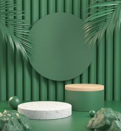 a green room with a round mirror, rocks and palm tree leaves on the wall