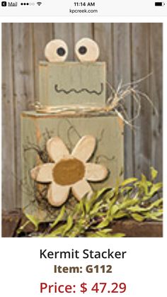 a wooden block with a flower on it and the words kermit stacker item g112 price $ 47 29