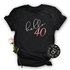 a black t - shirt with the words hello 30 printed on it next to a pink rose