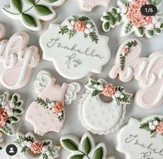 baby shower cookies decorated with pink flowers and greenery