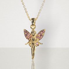 This fairy princess gold necklace is beautifully crafted with pink jewels on the wings. A fabulous gift idea. Gold chain. Suitable for children age 3 and over. Chain length 71/2 in. Fairycore Gold Necklaces For Party, Fairycore Gold Party Necklaces, Princess Style Gold Jewelry Gift, Gold Princess Style Jewelry For Gift, Princess Style Gold Jewelry For Gifts, Princess Style Gold Jewelry For Party, Fairy Style Gold Jewelry For Gift, Gold Fairycore Jewelry Gift