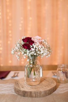 a vase filled with flowers sitting on top of a table