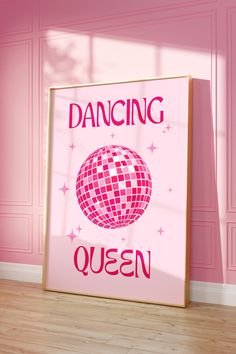 a pink poster with the words dancing queen on it in front of a pink wall