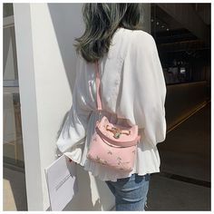 Brand Name: KylethomaswSize: Width: 17cm , Height: 17cm , Thickness: 10cm , Long strap: 120cmShape: BucketTypes of bags: Shoulder & Crossbody BagsMain Material: PUClosure Type: OPENHardness: SOFTLining Material: NonePattern Type: FloralNumber of Handles/Straps: SingleInterior: Interior Zipper PocketInterior: Interior CompartmentDecoration: EmbroideryDecoration: FlowersDecoration: LOCK Pink Shoulder Bucket Bag With Phone Holder, School Shoulder Bucket Bag With Detachable Strap, Spring Crossbody Shoulder Bag For School, Spring School Crossbody Shoulder Bag, Spring School Crossbody Satchel, Pink Crossbody Bucket Bag For Errands, Spring Bucket Bag With Adjustable Strap, Spring Bucket Bag With Detachable Strap For Errands, Portable Satchel Shoulder Bag For Spring