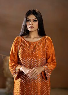 Add a touch of glam to your style with our Burnt Orange Sequins Outfit. It's perfect for standing out and looking classy at any event. Shine on effortlessly!