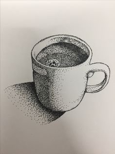 a drawing of a cup of coffee on top of a piece of paper with black dots