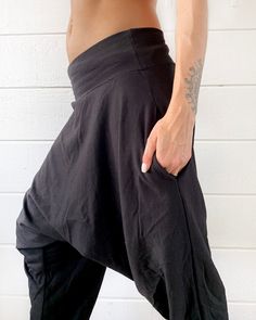 "Introducing new glorka ninja jogger pants design with a higher drop. Great as a casual wear, these avant garde pants are not as baggy as the original glorkas. Yet they are still super comfortable and made from the softest cotton blend. -Unisex -Stretch -Flowing relaxed fit -Inner drawstring to secure the waist -2 side pockets Wear it for Yoga, Dance, Exercises, Meditations, Yoga Practice and beyond... Materials: black color cotton blend (95% cotton 5% lycra). Fabric for this pair were bought in Baggy Wide Leg Hip Hop Harem Pants, Baggy Wide Leg Harem Pants Hip Hop Style, Casual Stretch Cargo Pants For Yoga, Casual Harem Bottoms With Side Pockets, Baggy Wide Leg Joggers With Side Pockets, Harem Pants With Side Pockets For Streetwear, Casual Baggy Harem Parachute Pants, Hip Hop Style Baggy Harem Pants With Pockets, Loosely Fitted Harem Pants With Side Pockets For Streetwear