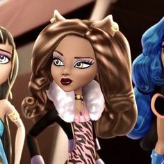 three barbie dolls are standing next to each other and one is holding scissors in her hand