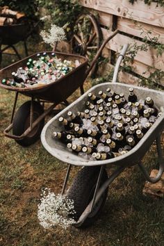 a wheelbarrow filled with lots of beer bottles