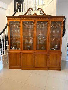 Large quality satinwood astral glazed breakfront display cabinet with original painted decoration  having a quality satinwood hand painted cornice with a swan-neck pediment above four large astral glazed satinwood doors opening to reveal glass display shelves above four satinwood panelled doors with painted decoration opening to reveal a shelved interior standing on a plinth base  A delightful example of first class quality and craftsmanship boasting a very desirable colour Dimensions: Height 24 Glass Display Shelves, Display Cabinet, Panel Doors, Display Shelves, Console Table, Living Furniture, Living Room Furniture, Home And Living, Shelves